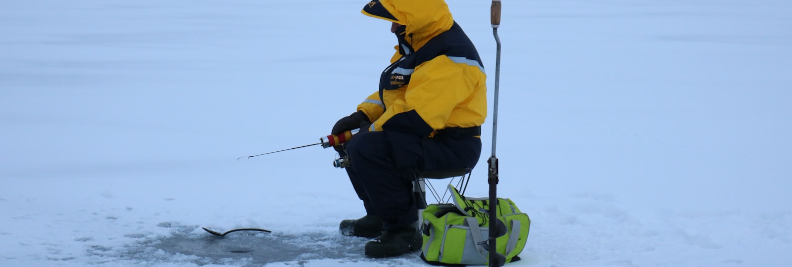Ice fishing on a frozen lake